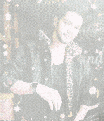a man in a leopard print jacket is surrounded by flowers and the words good