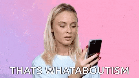 a woman is holding a cell phone in her hand and says `` that 's what aboutism '' .