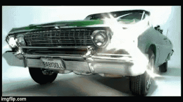 a green car with a license plate that says babydoll on it