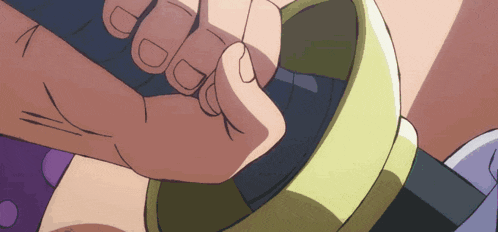 a close up of a person holding a sword in their hand