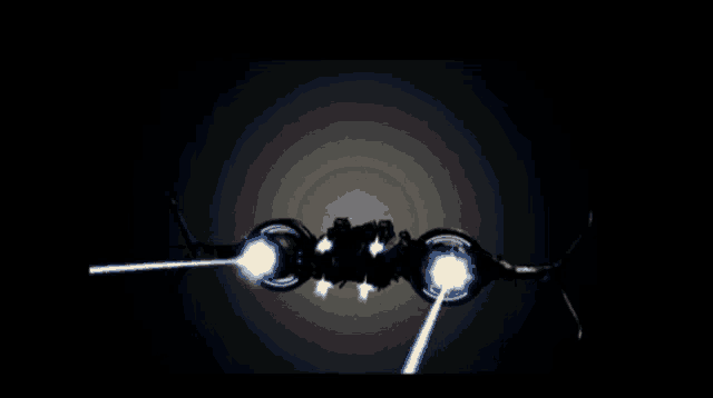 a dark background with a cube in the middle and a light coming out of it