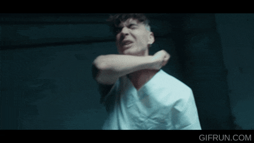 a man in a white shirt is being punched in the face by a gifrun.com website