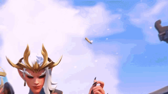a woman with a crown on her head is holding a pen in front of a blue sky .