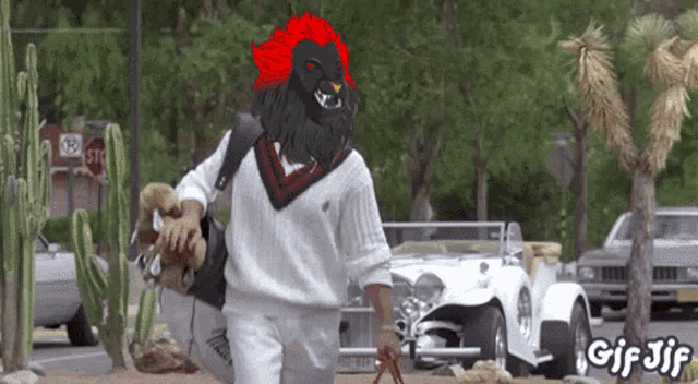 a gif of a man carrying a dog and a stop sign in the background