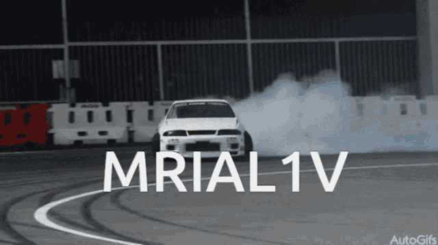 a white car is drifting on a track with the text mrial 1v