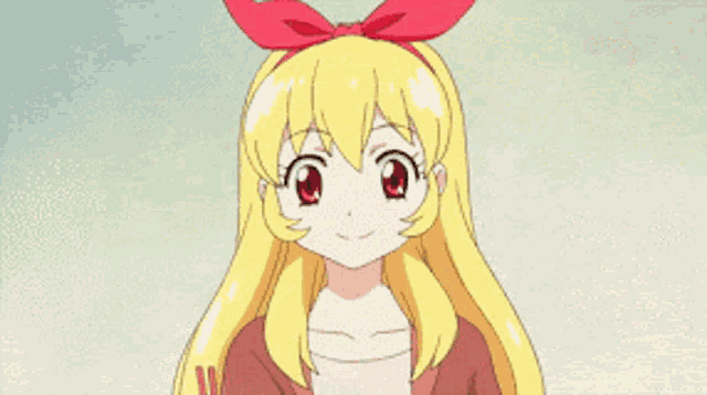 a girl with blonde hair and a red bow on her head is eating something with chopsticks