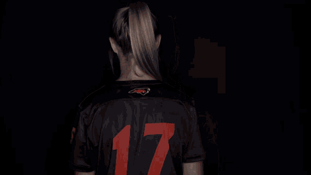 a woman wearing a black shirt that says lampbe