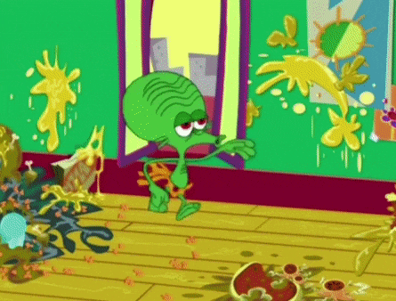 a green cartoon character is standing in a room with a lot of stains on the floor .