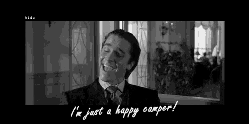 a man in a suit and tie says i 'm just a happy camper