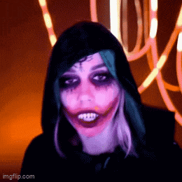 a woman is dressed up as the joker and has a purple face paint