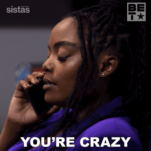 a woman talking on a cell phone with the words you 're crazy behind her