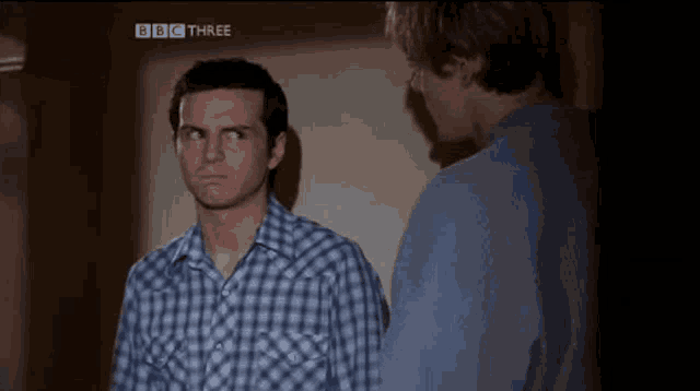 two men are standing next to each other with bbc three written on the bottom
