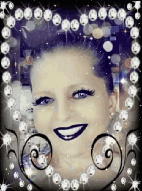 a woman 's face is surrounded by a frame of diamonds