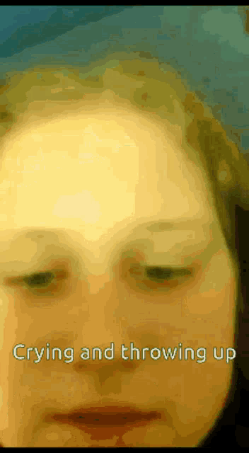 a close up of a woman 's face with the words " crying and throwing up " below it