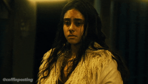 a woman in a fur coat with the hashtag @coffinposting on the bottom
