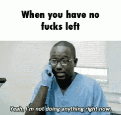 a man in scrubs is talking on a cell phone with the caption when you have no fucks left