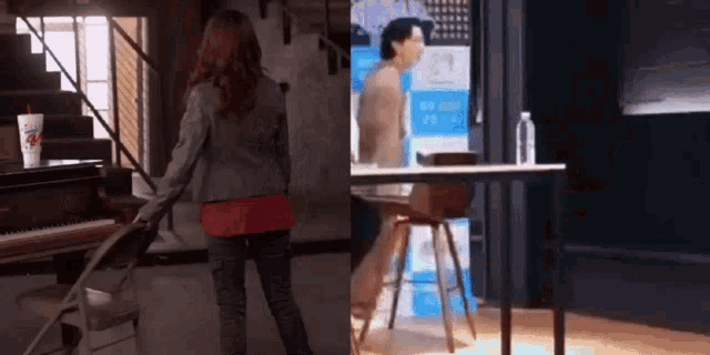 a woman is standing in front of a piano and a man is sitting at a table