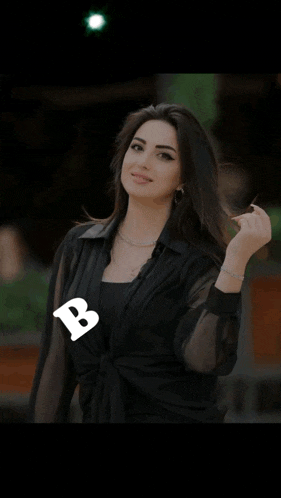 a woman in a black shirt with the words bonu written on the bottom