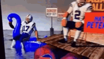 a football player with the number 17 on his jersey is standing on a dock