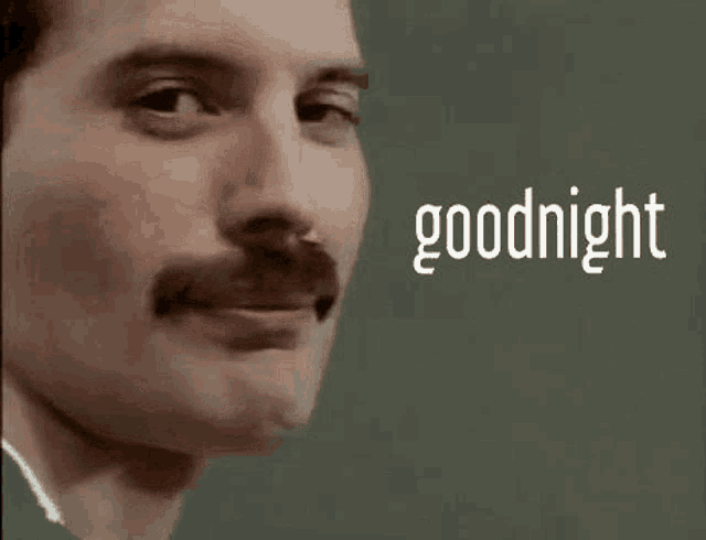 a close up of a man 's face with a mustache and the words `` goodnight '' written on it .