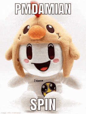 a stuffed animal wearing a chicken hat with pmdamian spin written on it