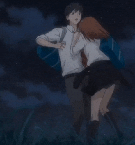 a boy and a girl standing next to each other
