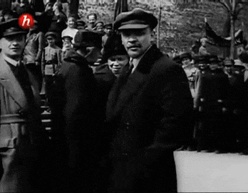 a group of men standing in front of a crowd with the letter h on the bottom