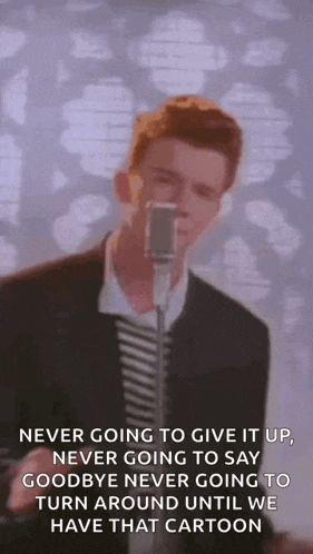 a man is singing into a microphone with the words `` never going to give it up '' .