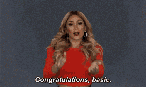a woman in a red shirt is saying congratulations , basic