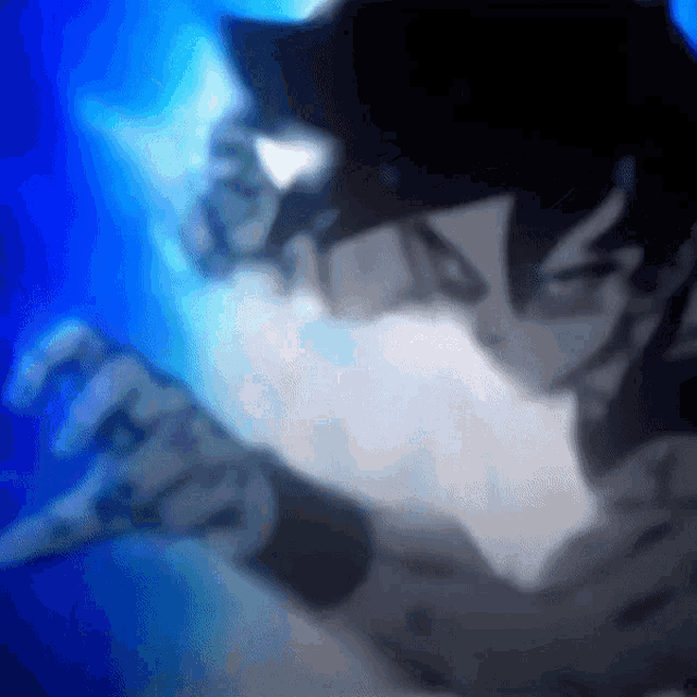 a blurry picture of a person 's face and hands with a blue background