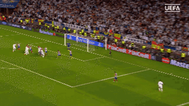 a soccer game is being played in front of a playstation sign