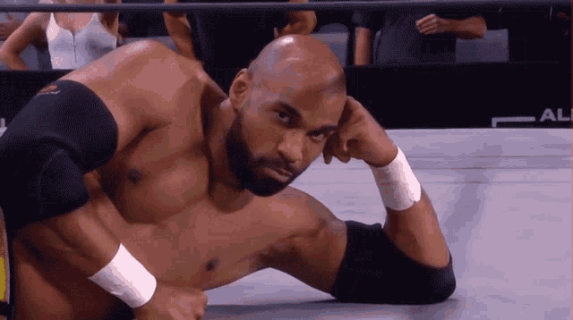 a man in a wrestling ring with the word ali on the corner