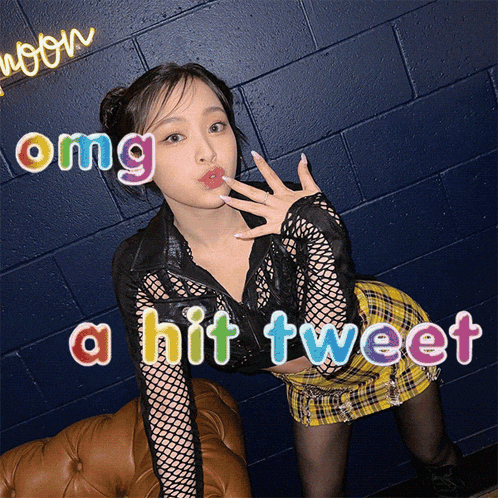 a woman in a plaid skirt with the words omg a hit tweet