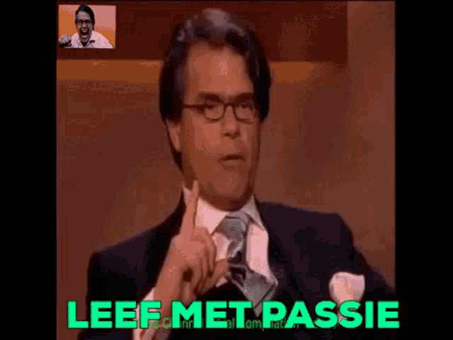 a man in a suit and tie has the word lief met assise on the screen