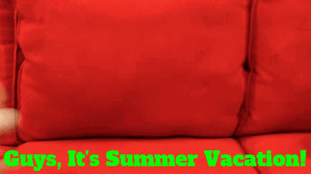 a red couch with the words guys it 's summer vacation written on it