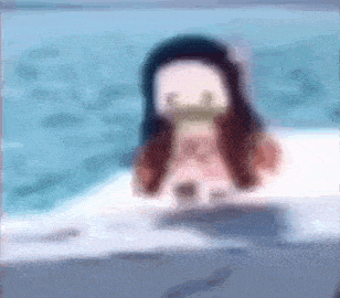 a blurred image of a girl in a bathtub with a mask on her face .