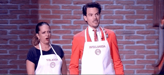 a man and a woman wearing aprons with avellaneda written on them