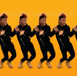 a group of young men are dancing in a row wearing black shirts that say trw on them