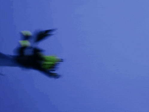 a cartoon character is flying through the air with a blue background