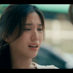 a close up of a woman 's face with the words `` i love you so much '' written next to her .