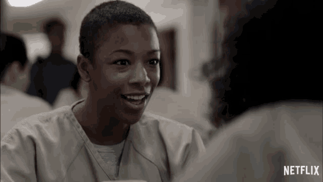 a netflix ad shows a woman in a jail cell smiling
