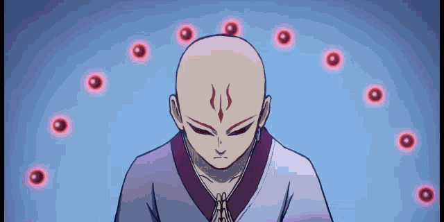 a man with a bald head is surrounded by red lights