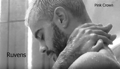 a black and white photo of a man taking a shower with the words ruvens pink crown below him