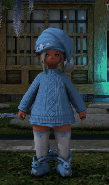 a little girl wearing a blue sweater and bunny boots