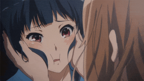 a close up of a girl 's face with her hand on it
