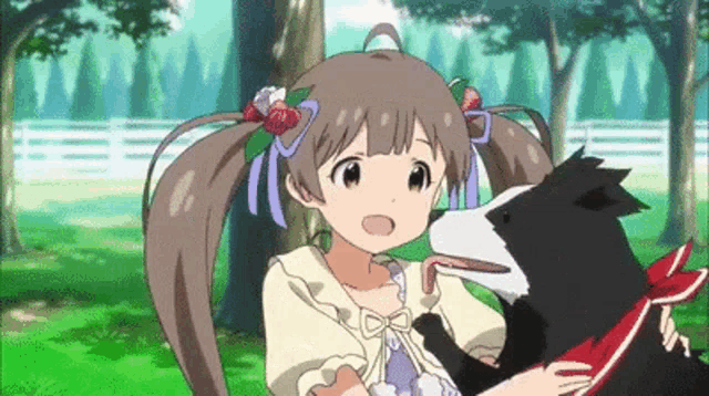 a girl is petting a black and white dog