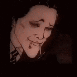 a man in a suit and tie is smiling with a cigarette in his mouth .