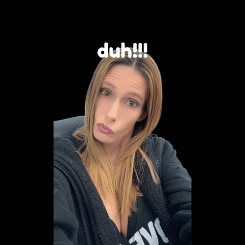 a woman taking a selfie with the words duh !!! above her head
