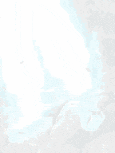 a person is standing in a cave with a blue light coming out of it