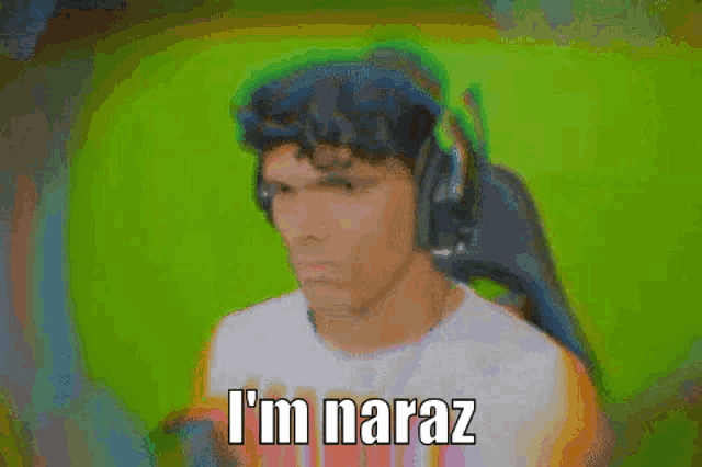 a man wearing headphones is making a funny face and saying `` i 'm naraz '' .